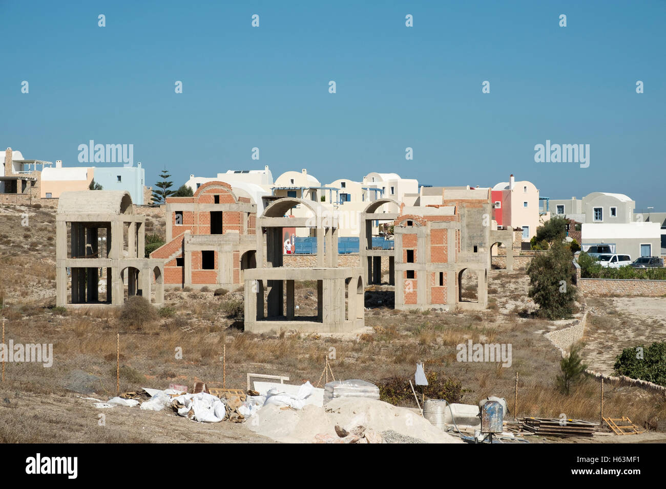 New houses under construction at Akrotiri on the island of Santorini, Greece with the caldera in the background. Stock Photo