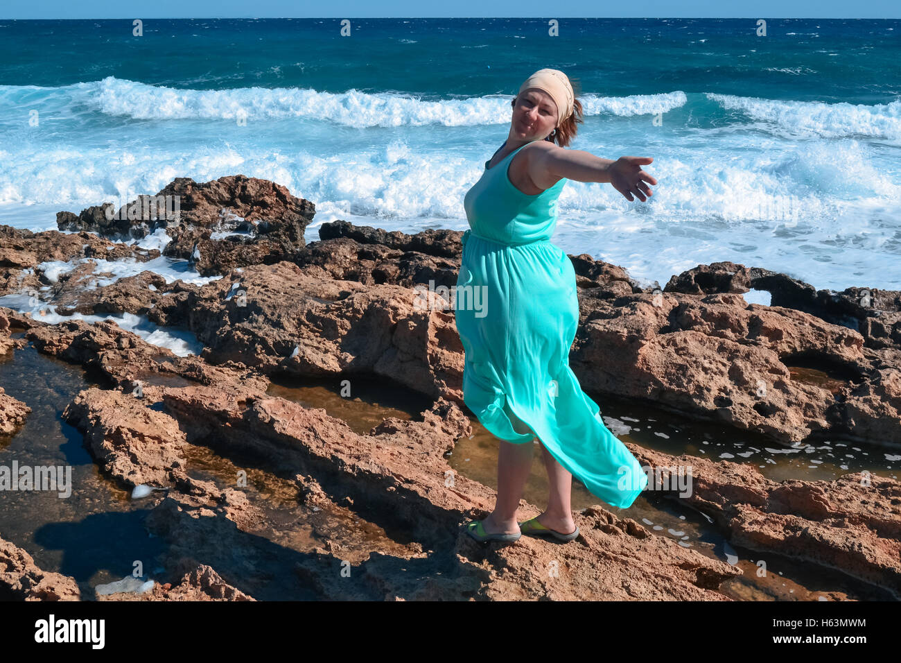 Mature woman enjoying herself on the beach Stock Photo - Alamy