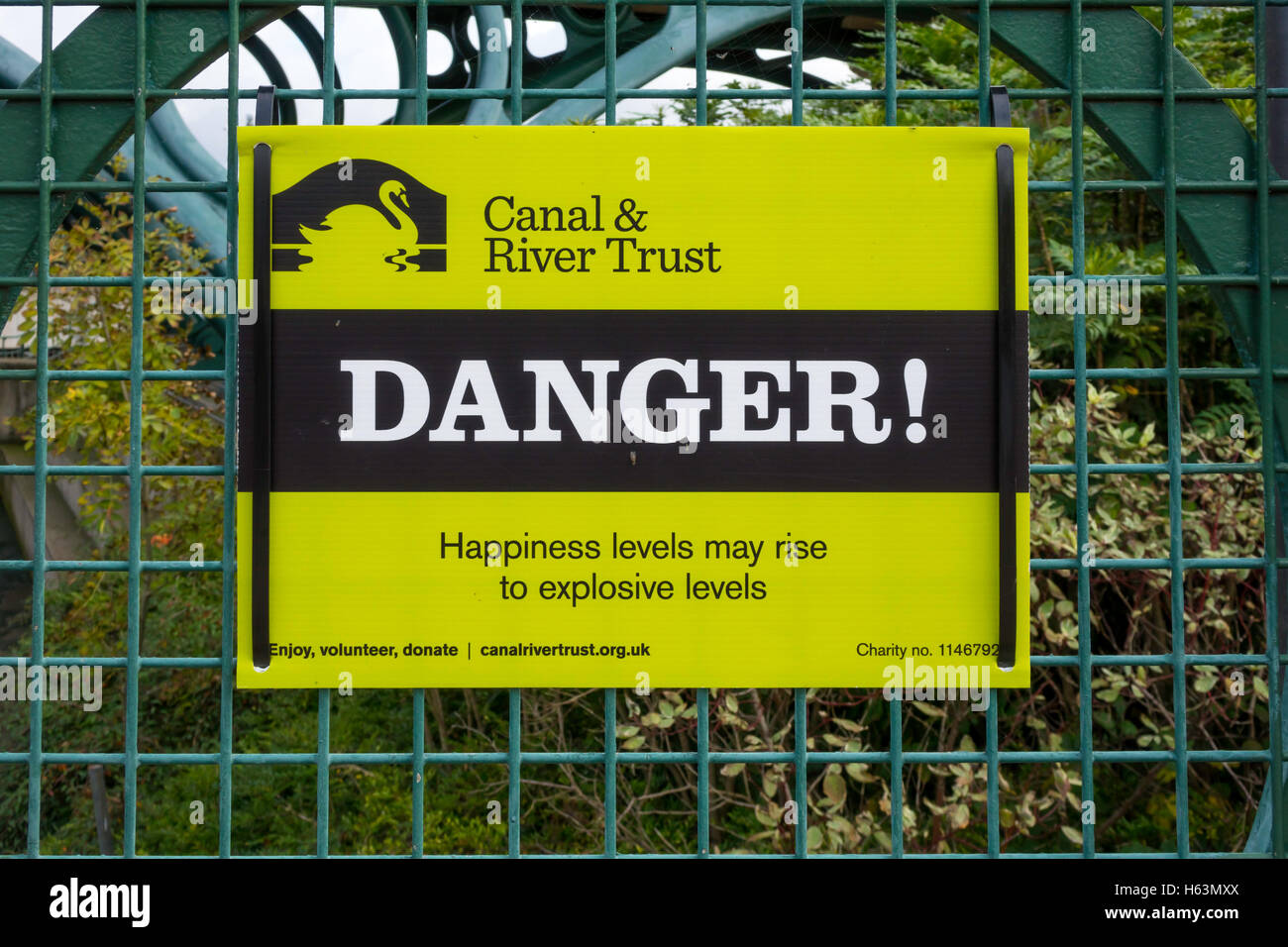 Canal and River Trust unusual Danger notice reads Happiness levels may rise to explosive levels Stock Photo