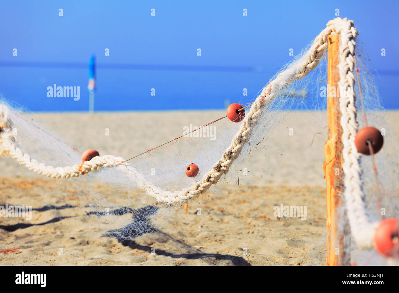 Drying fish net near the sea. Candid shot Stock Photo