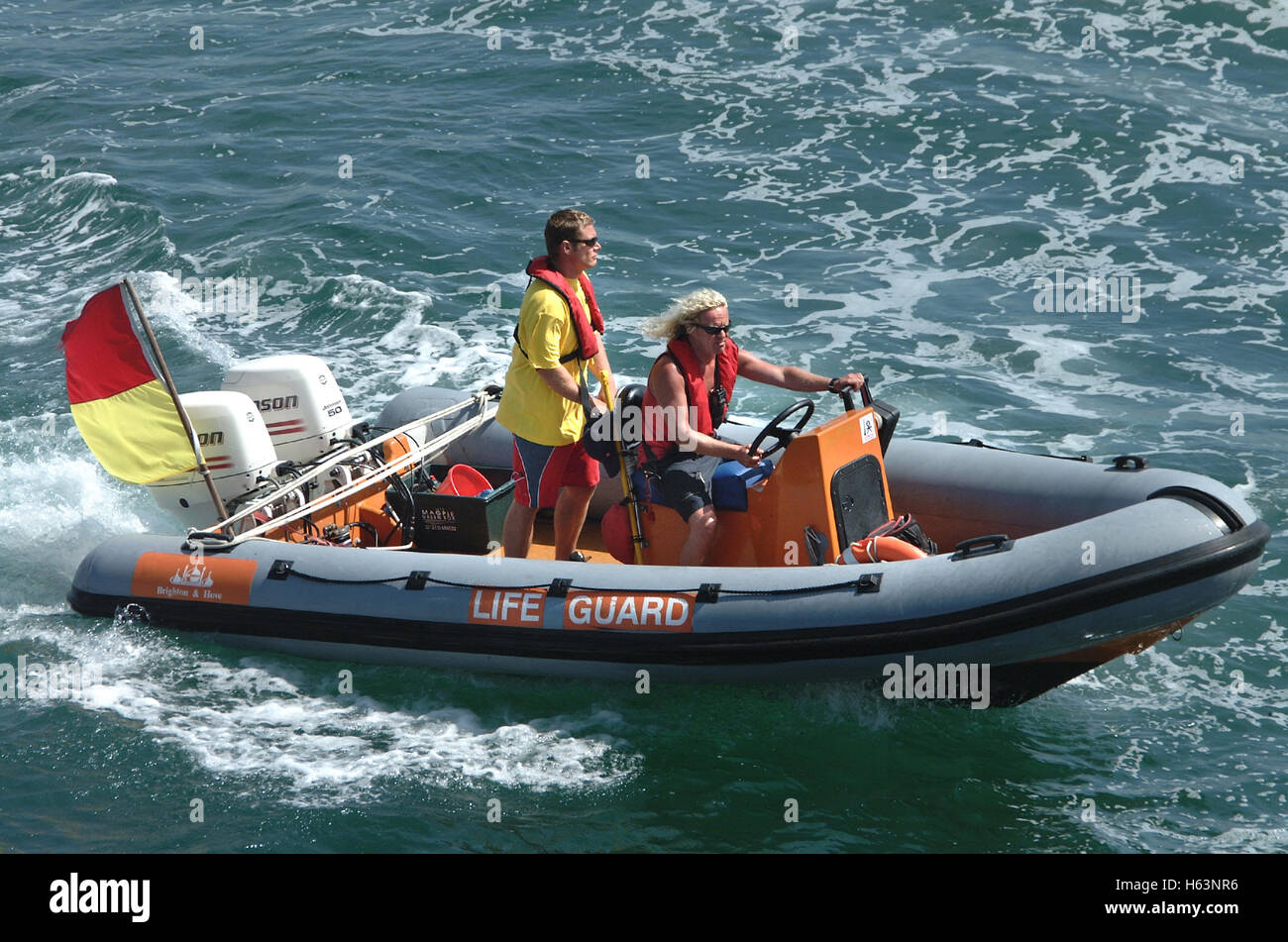 Lifeguards operating a Inflatable rib Stock Photo - Alamy