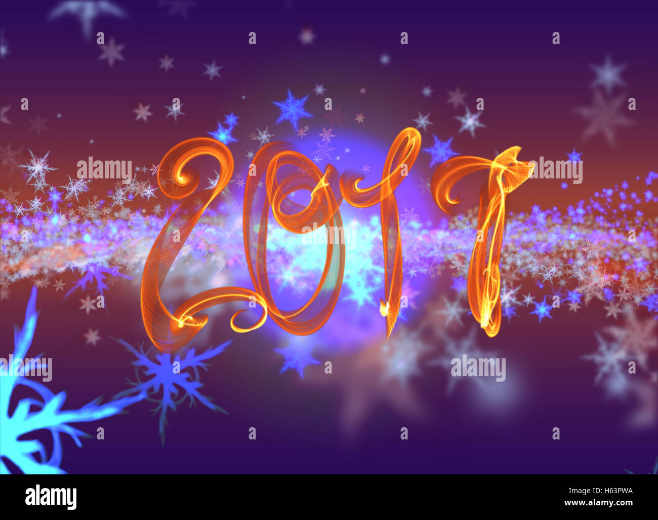 Snowflakes winter field cloud background and 2017 fire flame lettering. Happy new year, Christmas theme blurred bokeh. Stock Photo