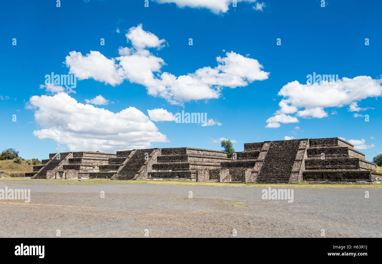 Three of the twelve small pyramids surrounding the Plaza of the Moon in front of the Pyramid of the Moon in San Juan Teotihuacan Stock Photo