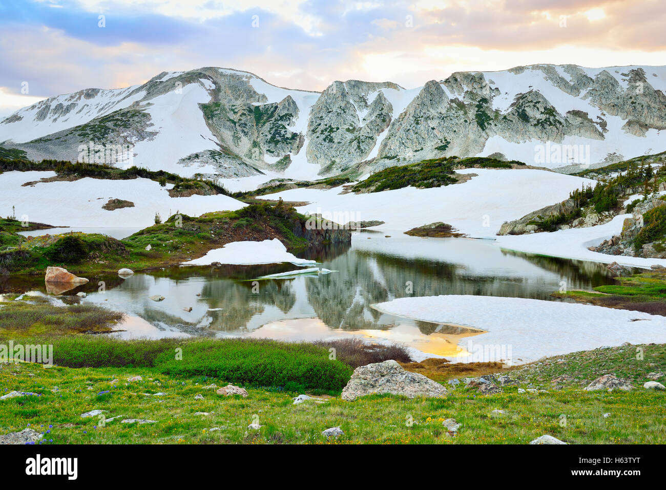 Snowy Range Mountains and alpine lake with reflection in Medicine Bow