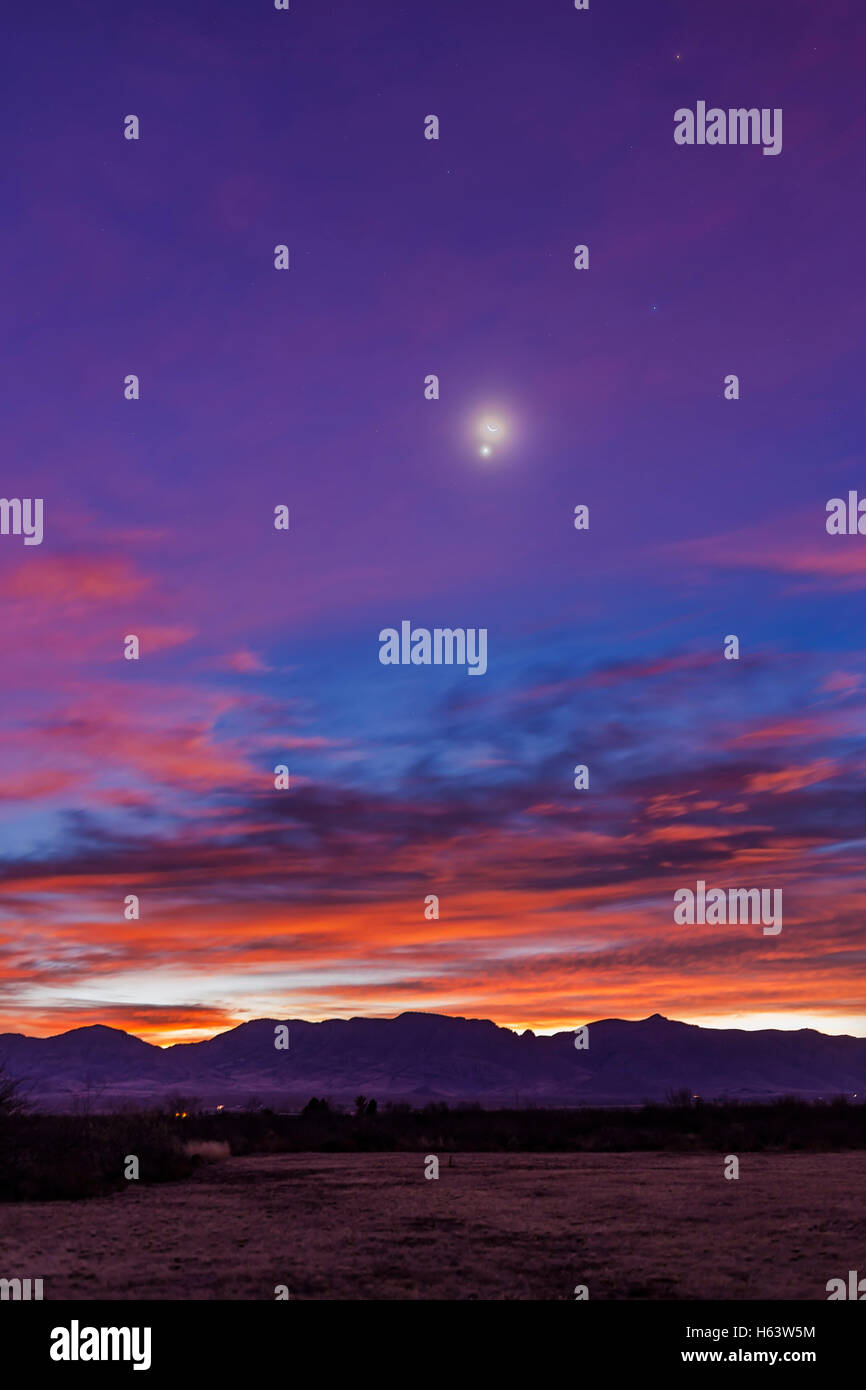 The waning crescent Moon and Venus in a close conjunction at dawn in the desert skies of Arizona, but here looking east toward N Stock Photo