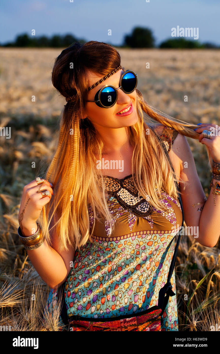 a Beautiful hippie girl at sunset Stock Photo