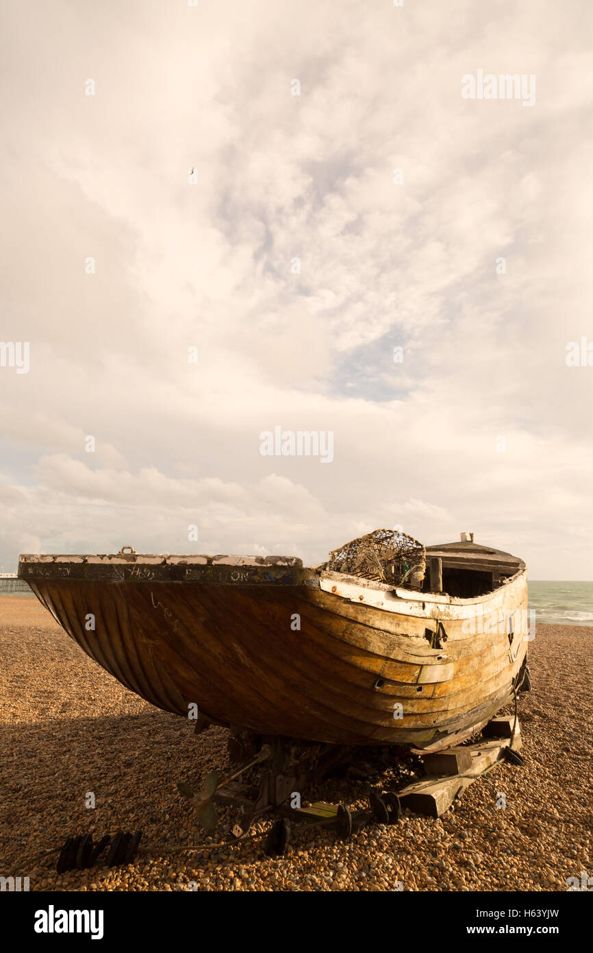 Old wooden rowing boat, Brighton beach, Brighton, East Sussex England UK (See also image H63YJY ) Stock Photo