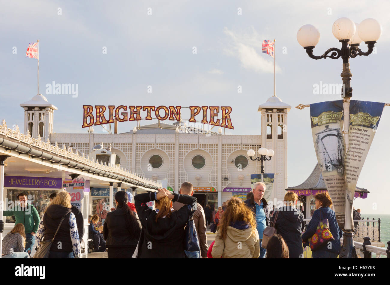 People enjoying themselves on Brighton Pier; East Pier, Brighton, East Sussex, England UK Stock Photo