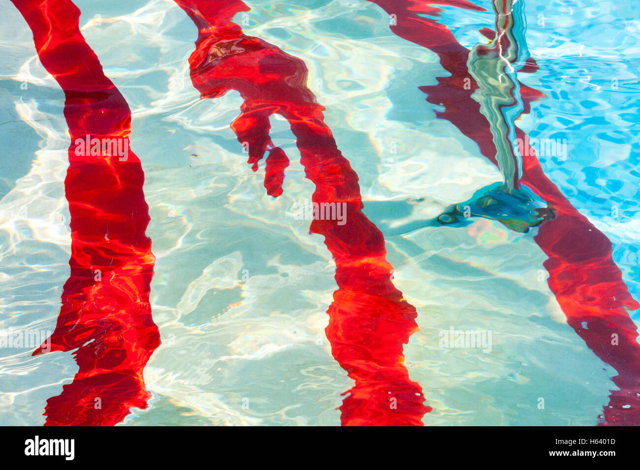 red and white striped swimming pool steps Stock Photo