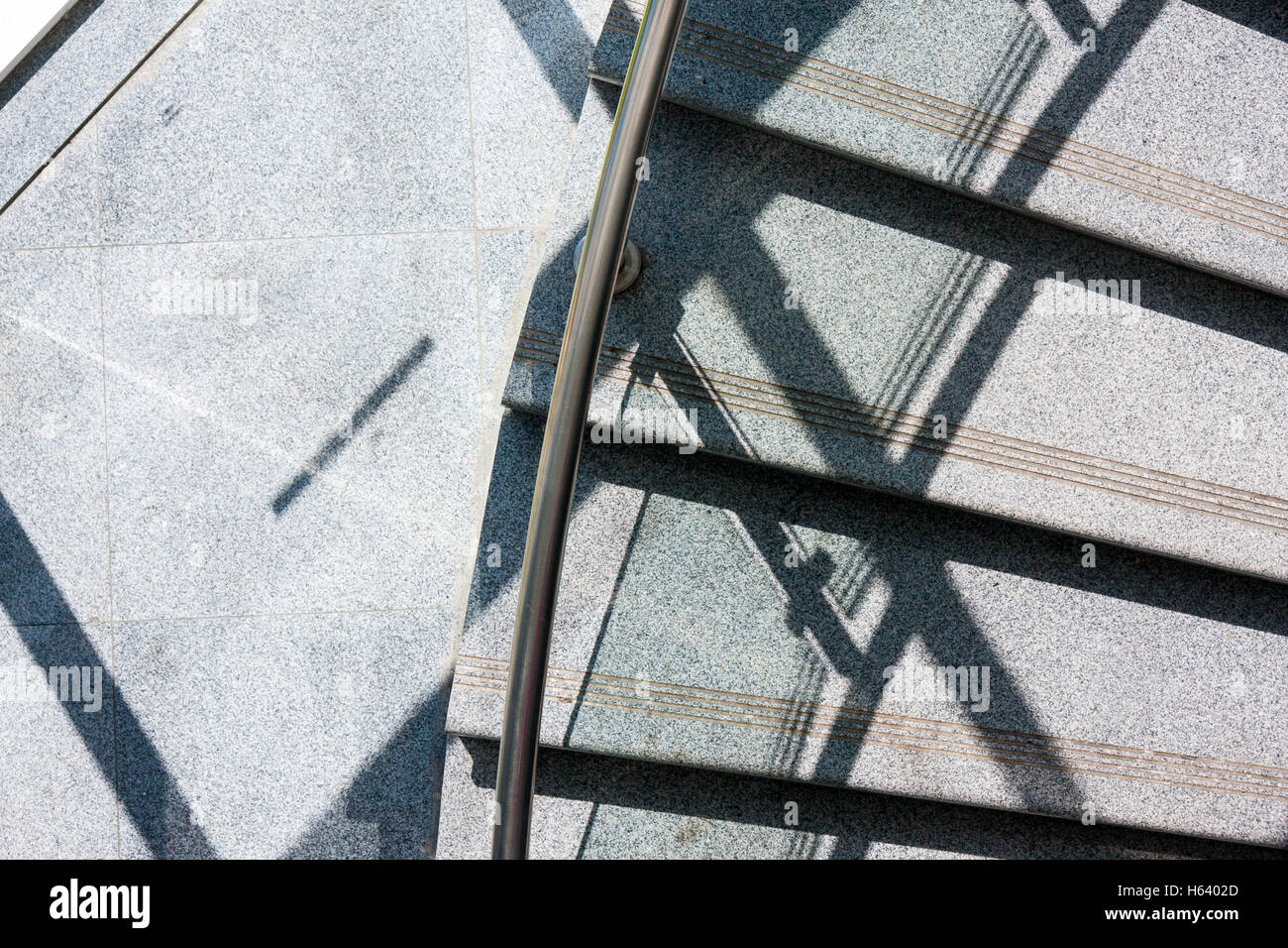 sunlight and shadows on spiral staircase Stock Photo