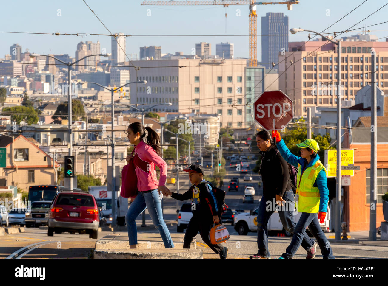 San Francisco, CA, USA, People, Street Scenes, Safety Guide Person Holding Stop Sign at Intersection, Family crossing, City Scapes / Skylines US Stock Photo