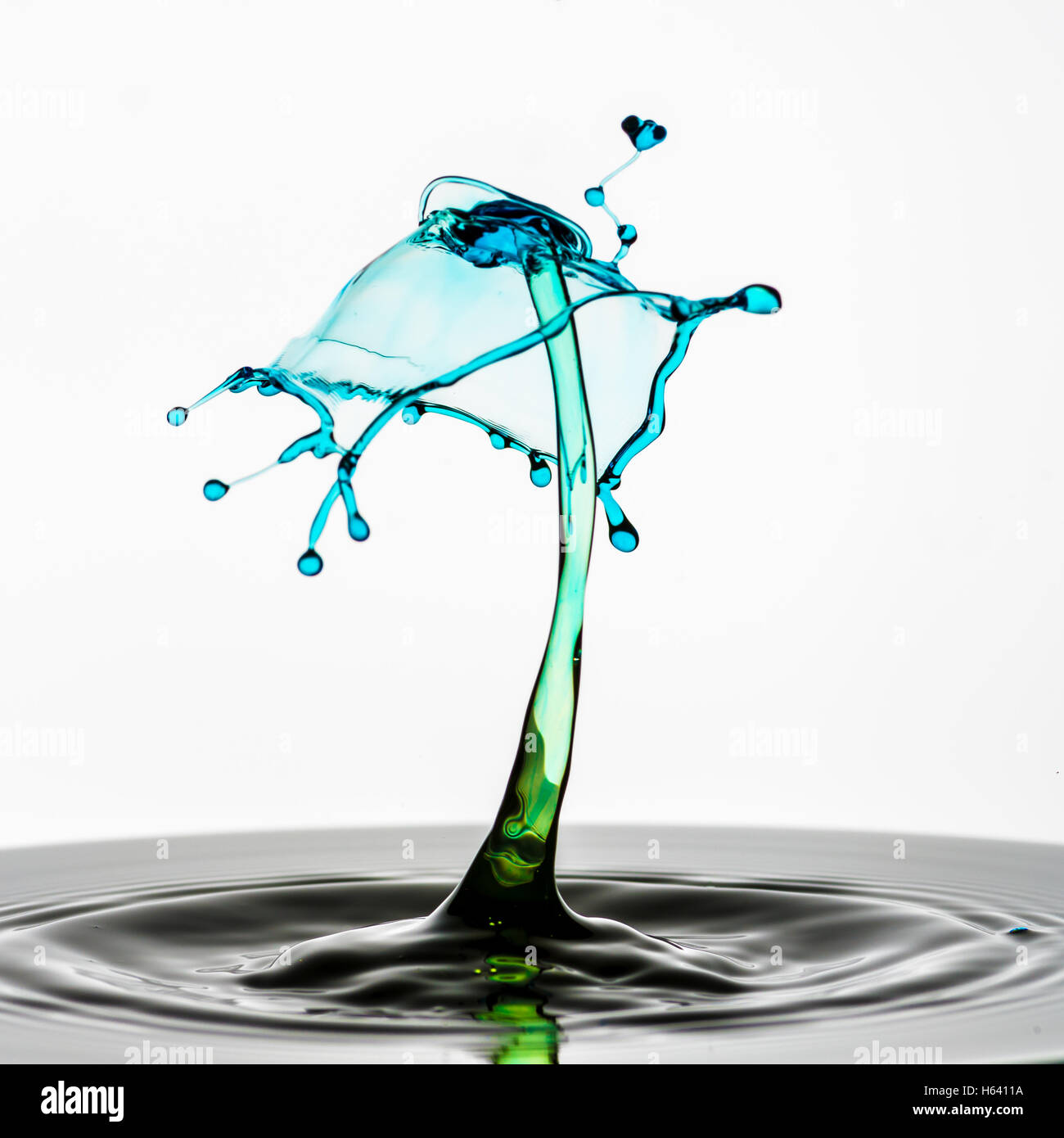 Water droplets colliding in high speed flash image Stock Photo