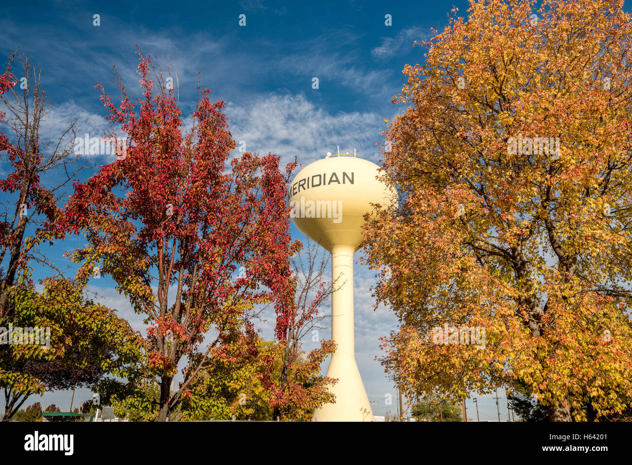 Water tower in Meridian Idaho with fall colored trees Stock Photo