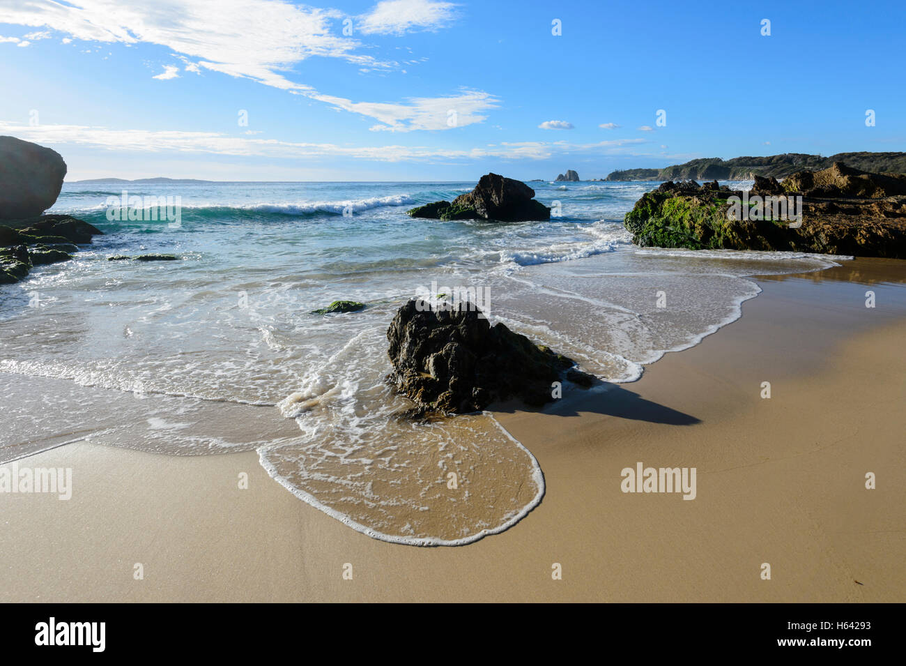 Narooma Surf Beach with the Glasshouse Rocks in the distance, New South Wales, NSW, Australia Stock Photo