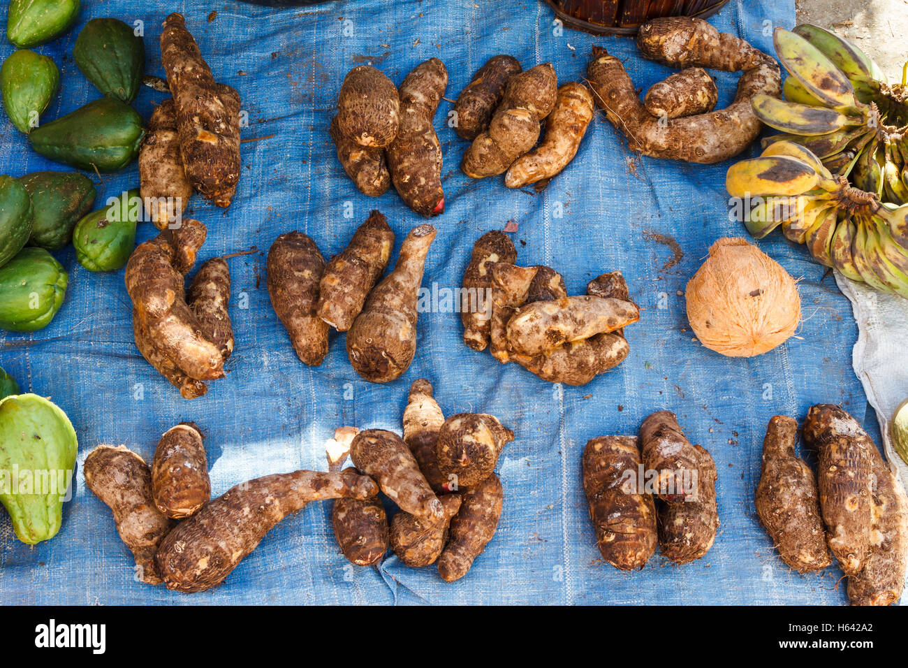 Cassava roots in a market. Stock Photo
