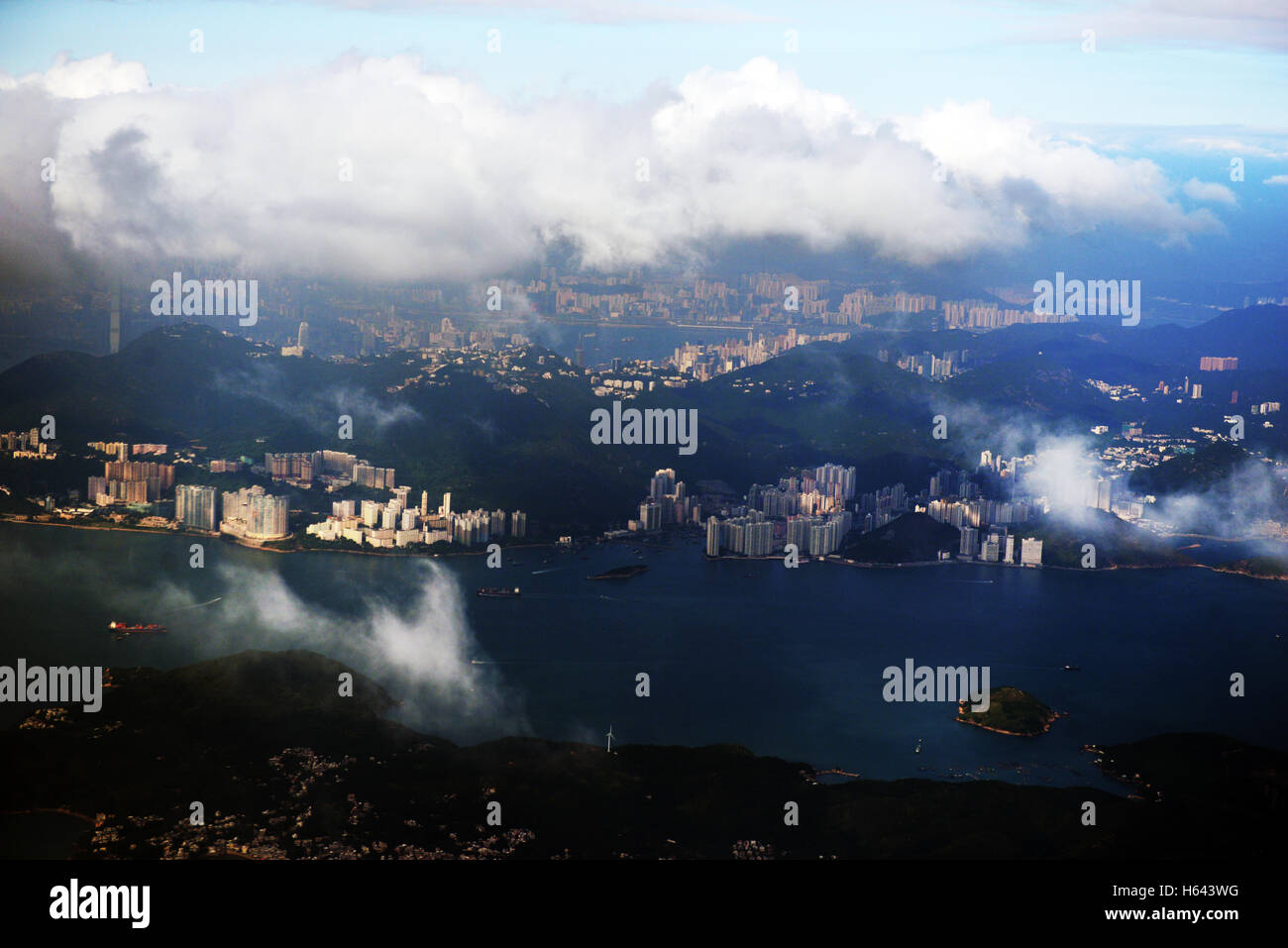 An aerial view of Hong Kong Island's 'South side' with Kowloon in the background. Stock Photo