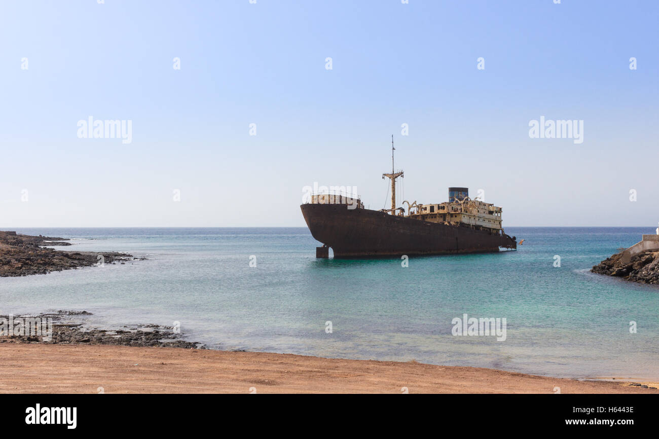 Old broken ship agrounded near Lanzarote seashore, Canary Islands, Spain Stock Photo