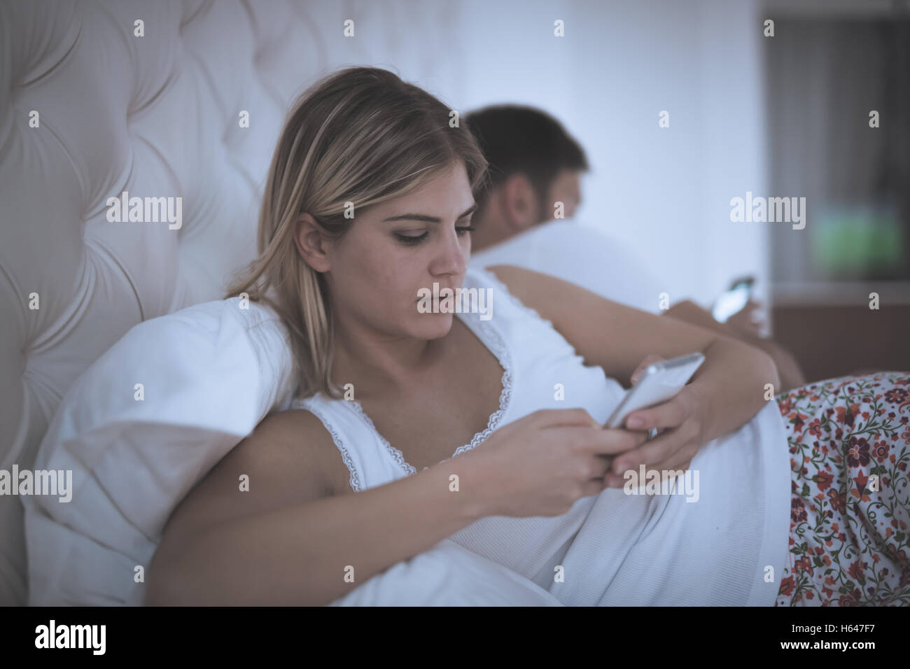 View of Couples issues with technology addiction affects marriage Stock Photo ...