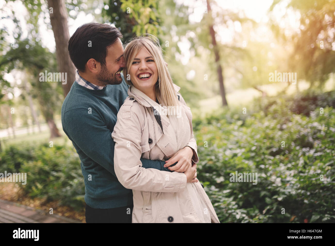 Loving happy couple hugging in park Stock Photo - Alamy