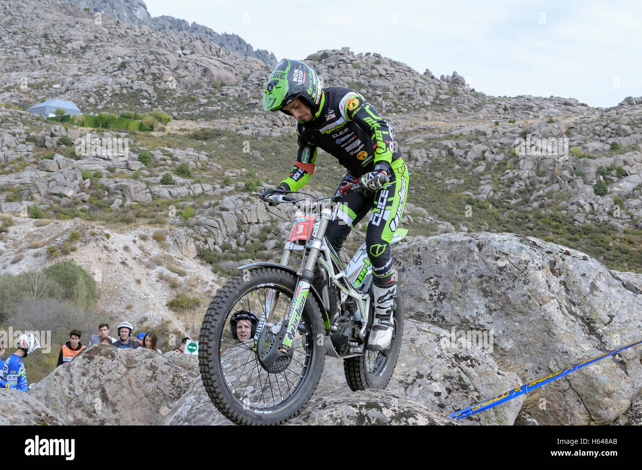 Motorcycling. Trial race. Spain championship. Jeroni Fajardo overtaking an obstacle, over granite rocks, in Valdemanco Stock Photo