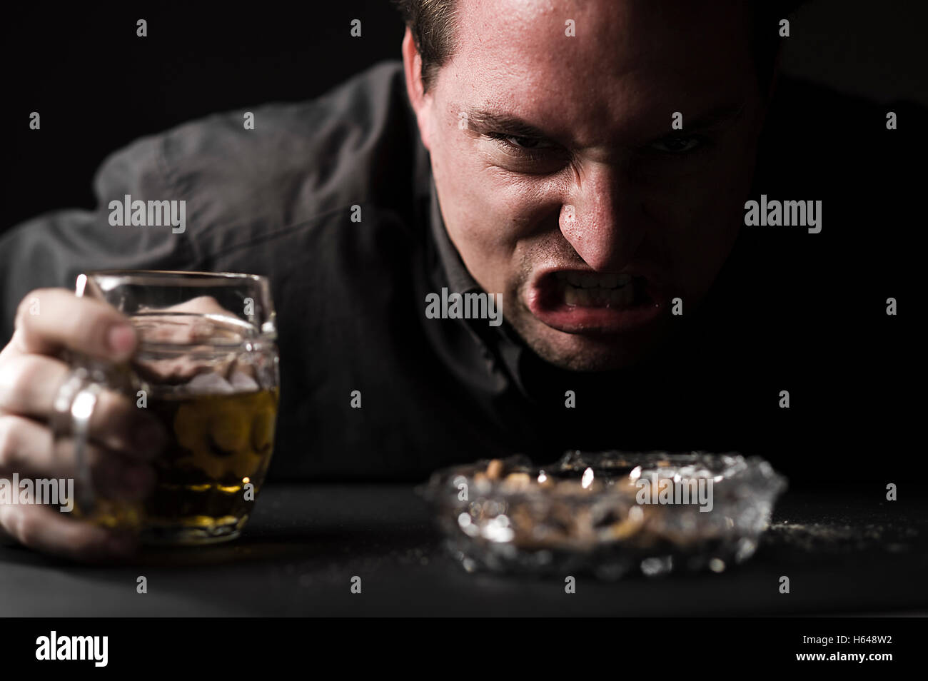 Aggressive man with beer Stock Photo