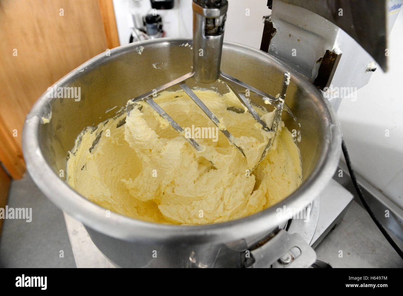 Baker making recipes and baking cakes and loaves in an oven Stock Photo