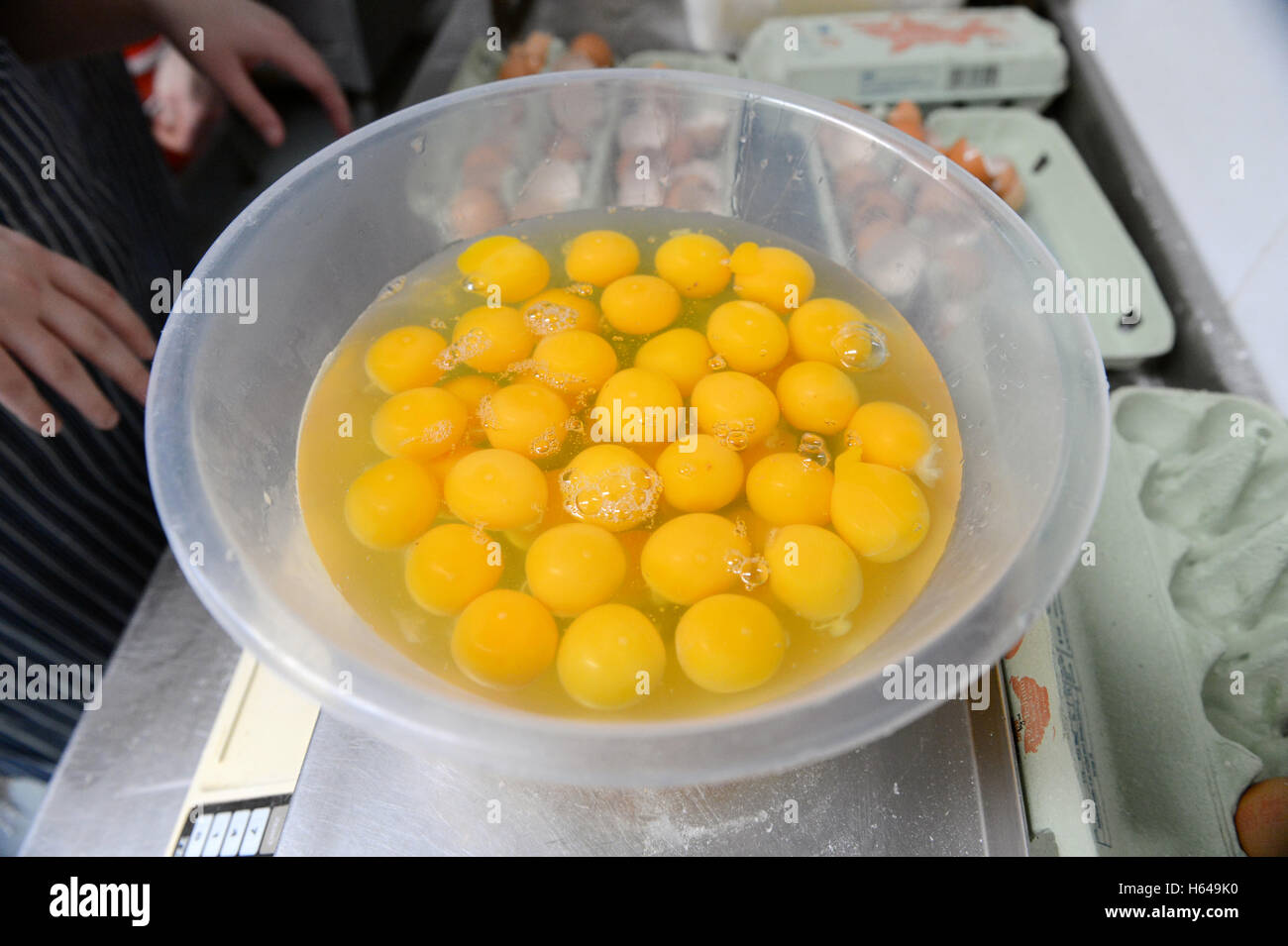 Baker making recipes and baking cakes and loaves in an oven Stock Photo