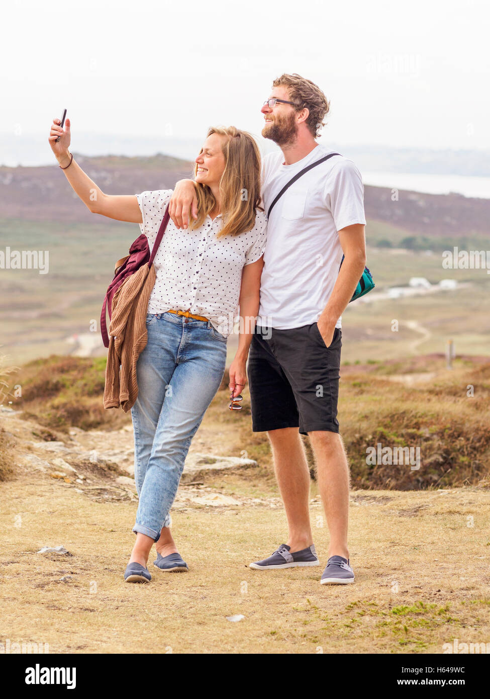 Couple at the beach taking a selfie Stock Photo