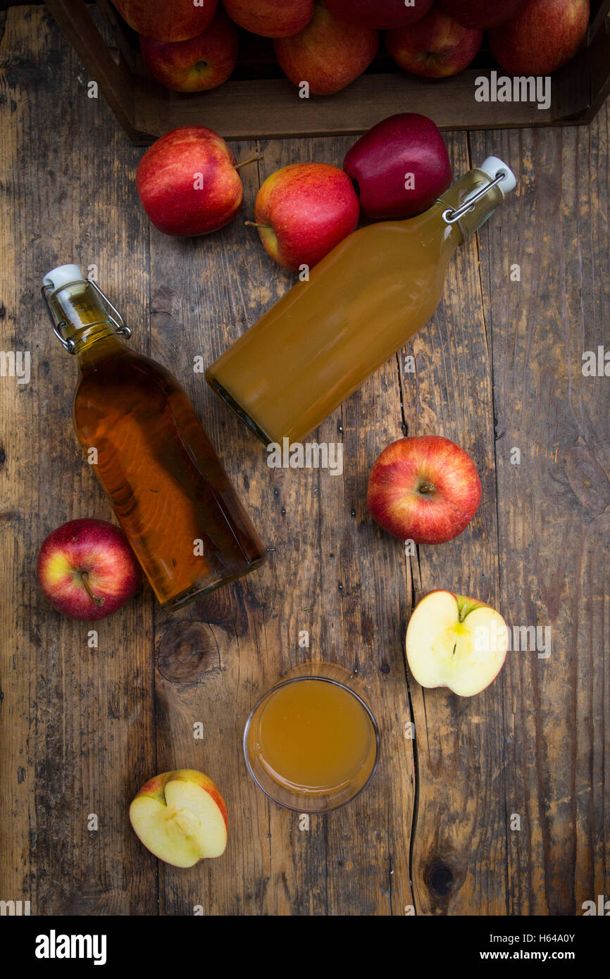 Download Bottle And Glass Of Apple Juice Cloudy And Clear Red Apples On Wood Stock Photo Alamy Yellowimages Mockups