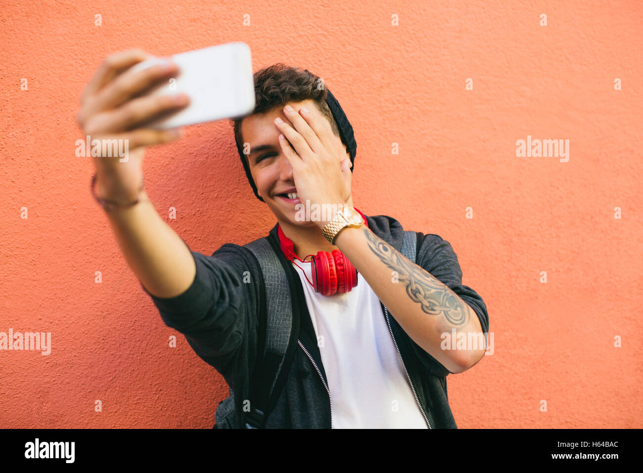 Teenager, smiling, selfie, smartphone Stock Photo
