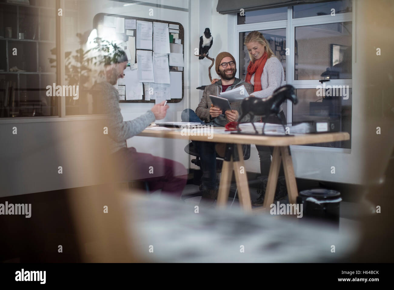 Young man and woman working together in designer office Stock Photo - Alamy