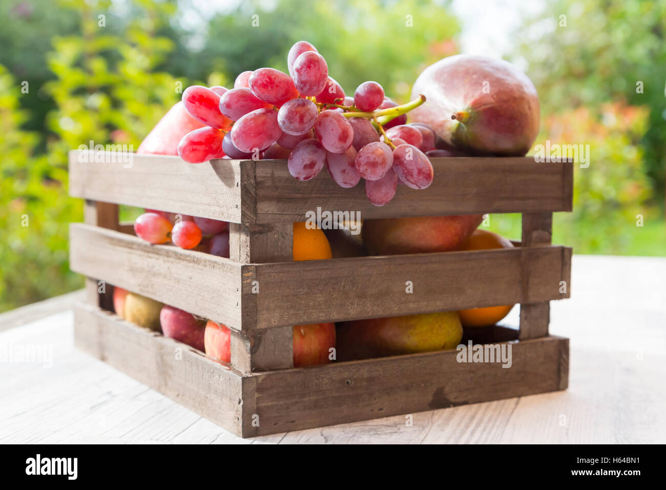 Wooden box with different fruits Stock Photo - Alamy