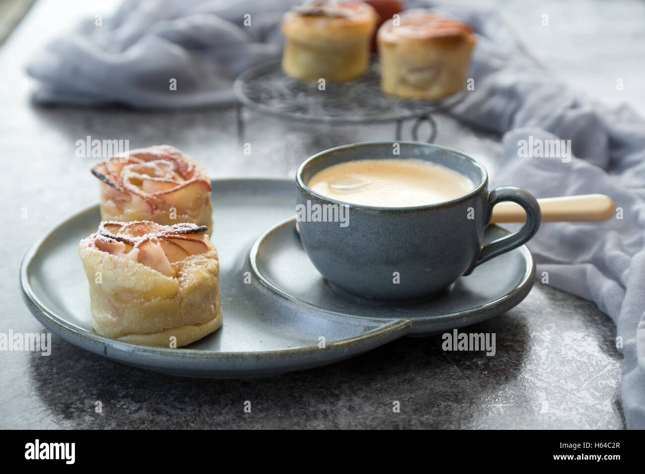 Filo pastry apple cakes in rose shape with cup of coffee Stock Photo ...