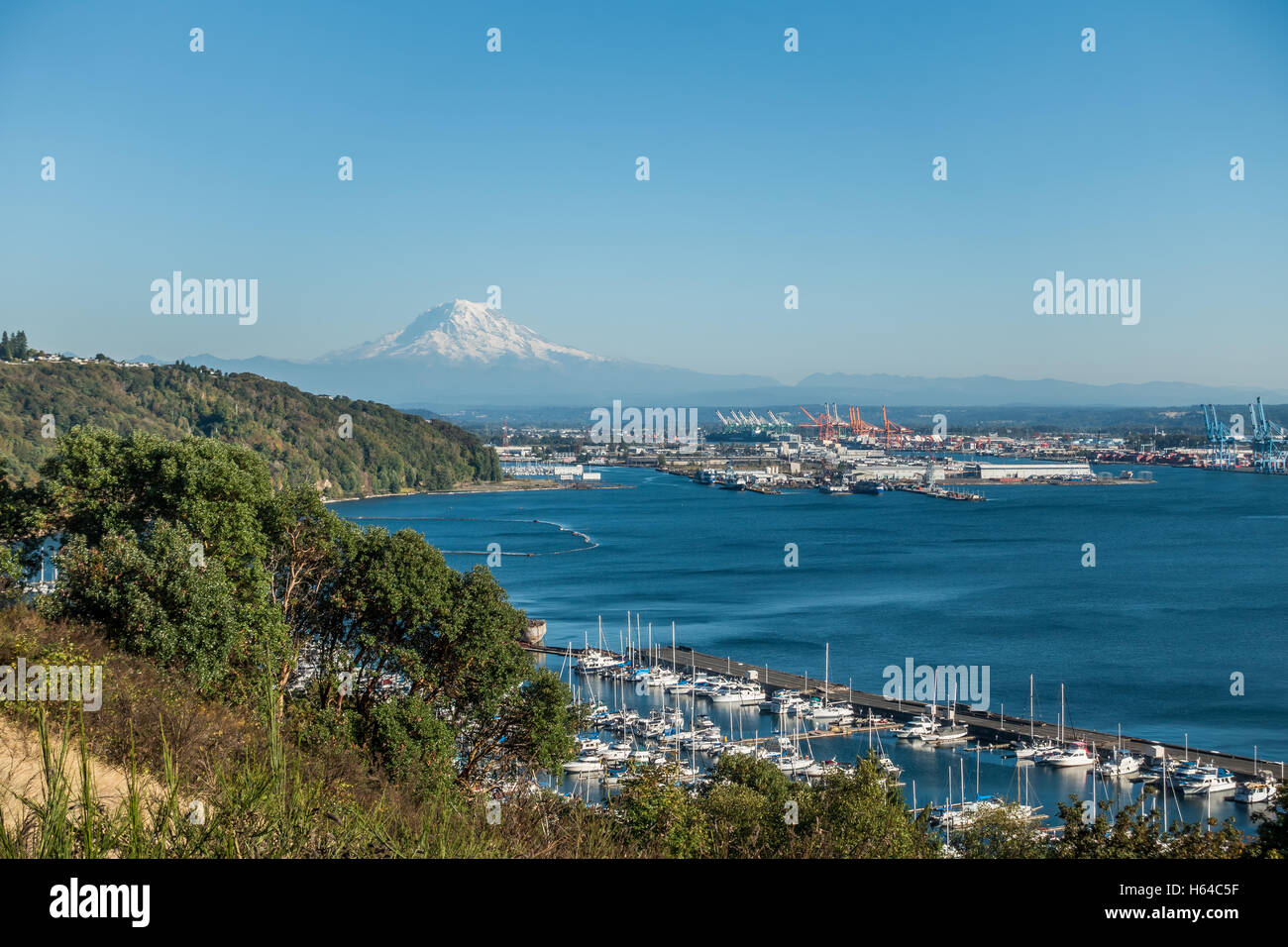 Mount Rainier towers over the Port of Tacoma. Stock Photo