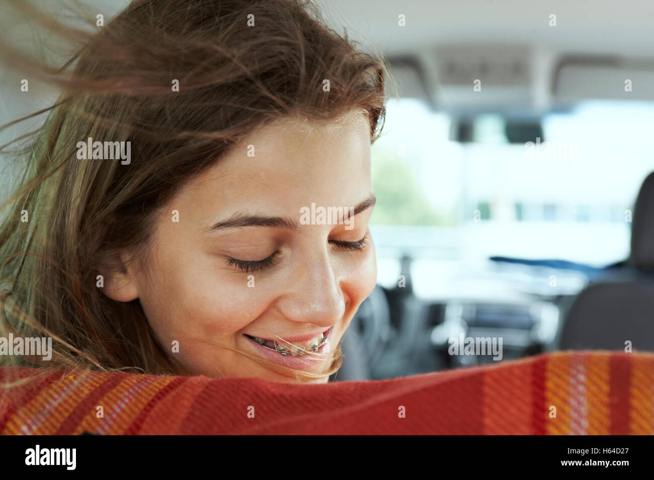 Smiling teenage girl with braces inside car Stock Photo Alamy