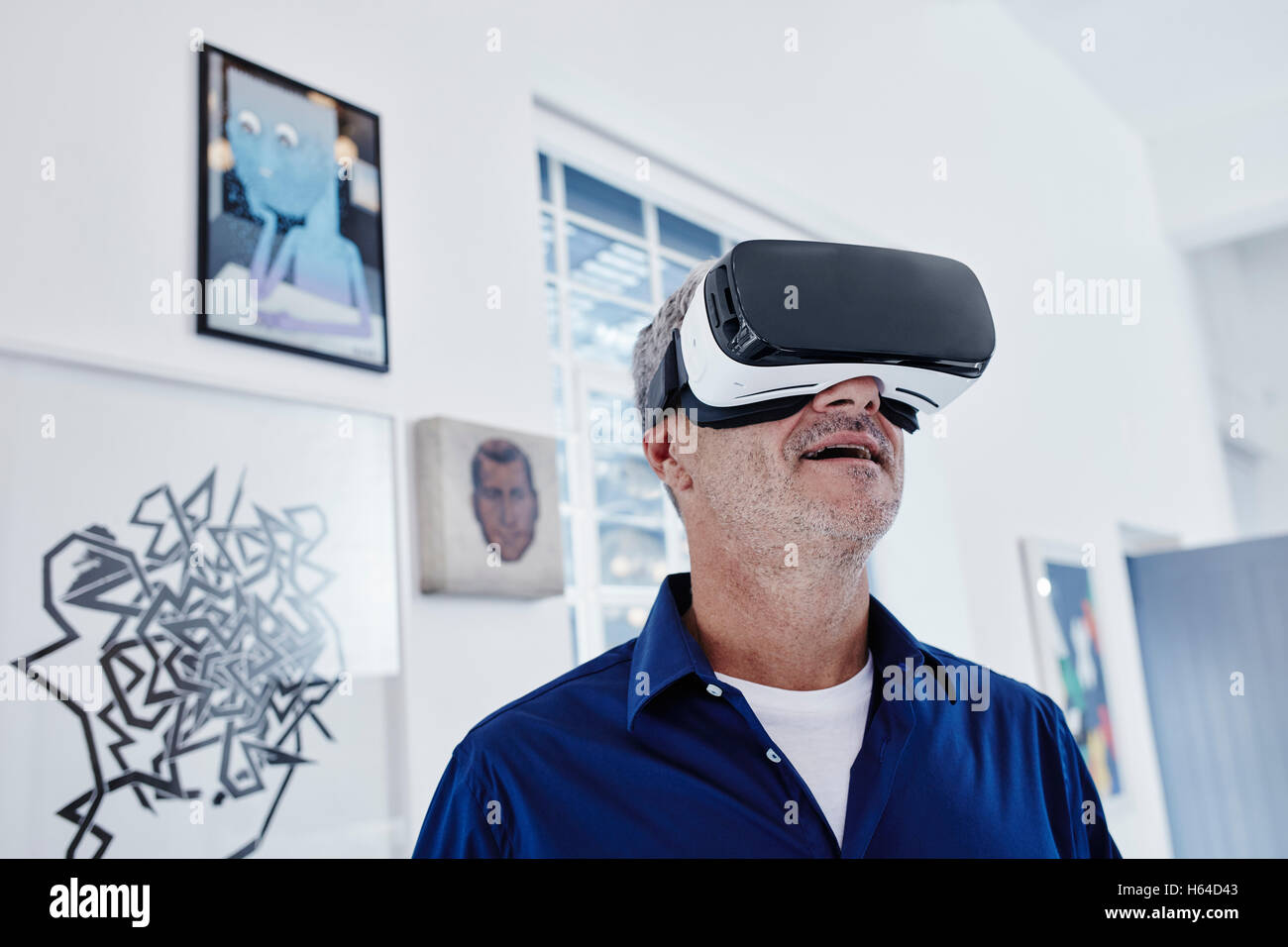 Mature man wearing virtual reality glasses Stock Photo - Alamy