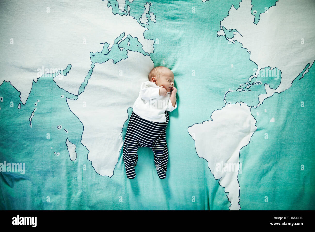 Newborn baby sleeping on blanket with world map Stock Photo Alamy