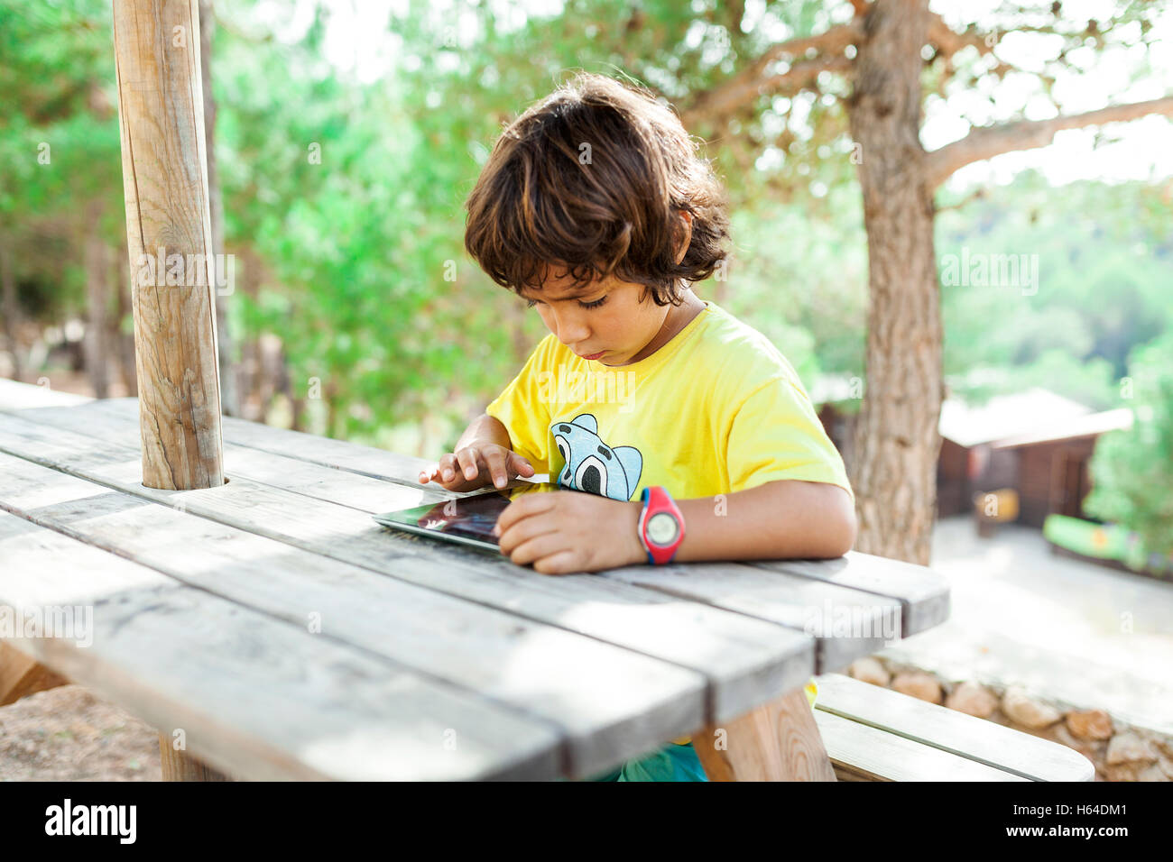 Little boy using tablet Stock Photo - Alamy