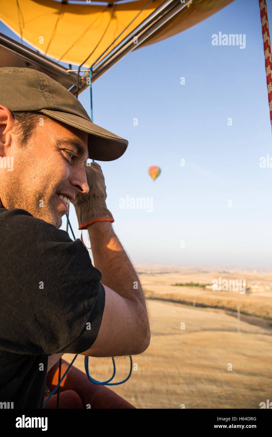 Smiling hot air balloon pilot observing the landscape Stock Photo Alamy