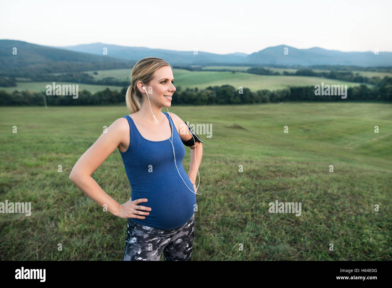 Pregnant woman standing on hill hi-res stock photography and images - Alamy