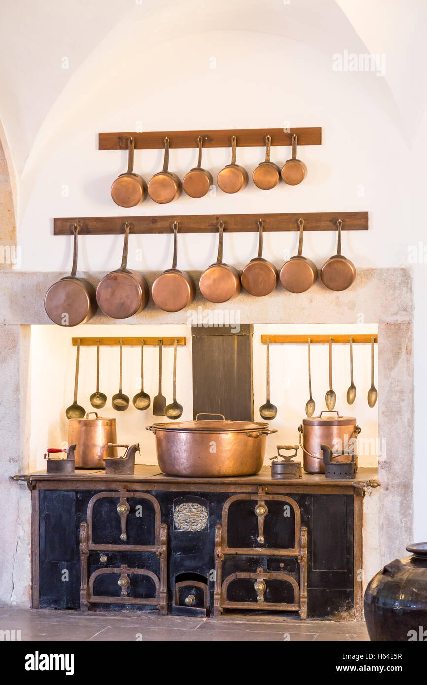 interior old kitchen with vintage kitchenware in palace Stock Photo