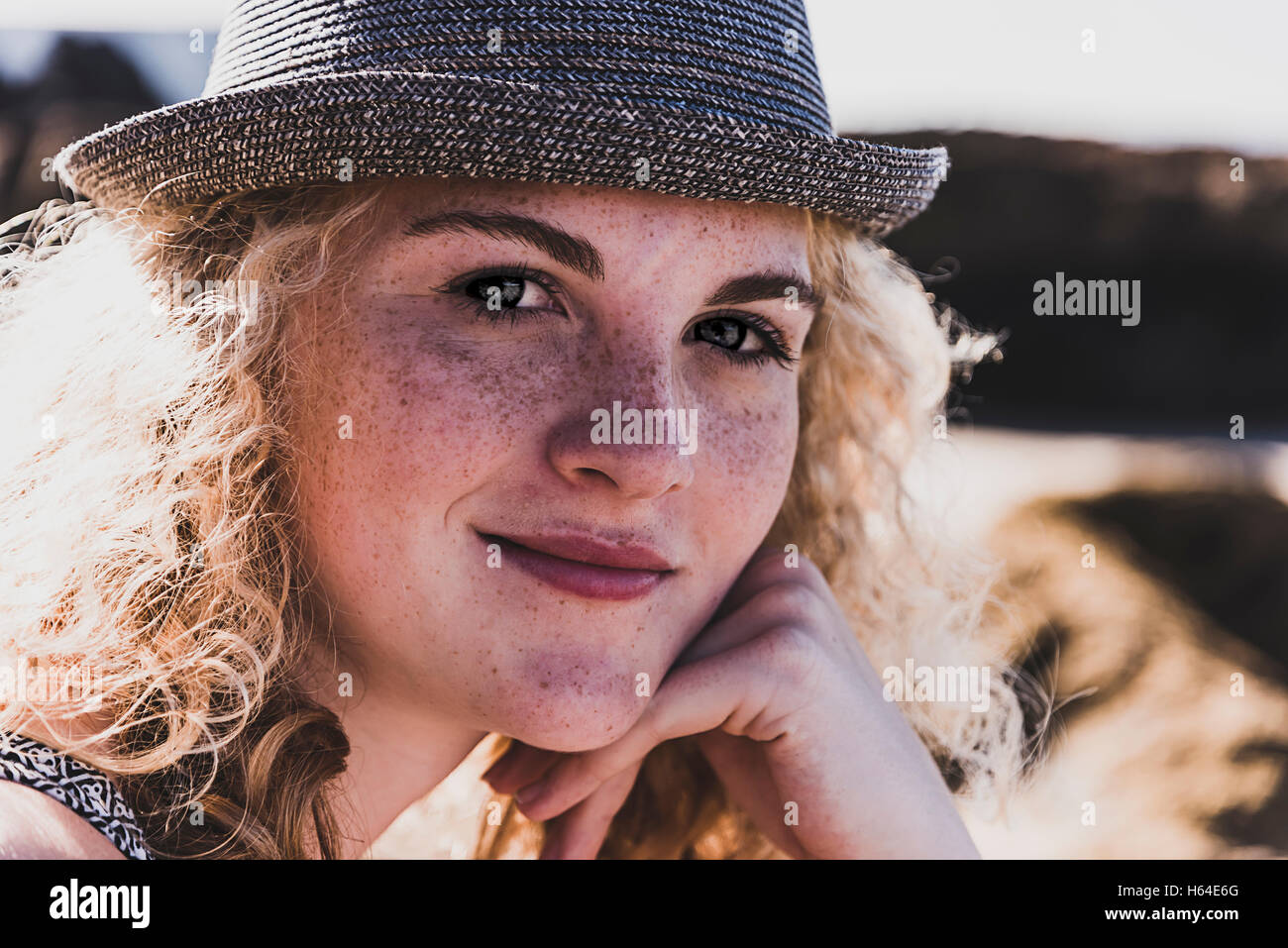 Portrait of teenage girl with freckles wearing a hat Stock Photo