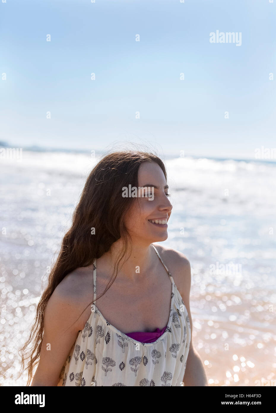 Happy young woman on the beach Stock Photo - Alamy