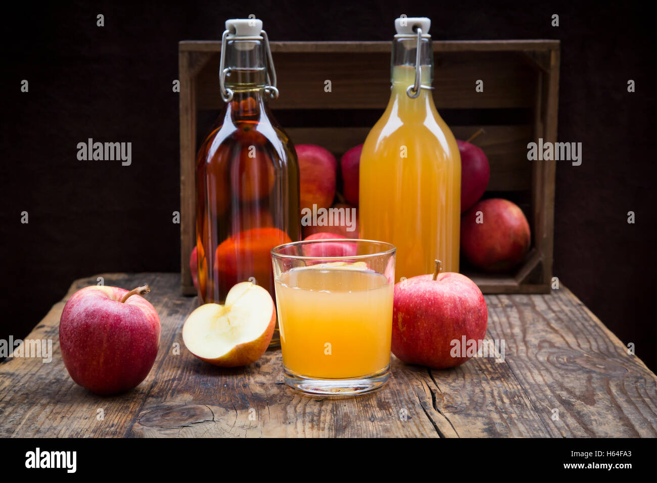 Download Bottle And Glass Of Apple Juice Cloudy And Clear Red Apples On Wood Stock Photo Alamy Yellowimages Mockups