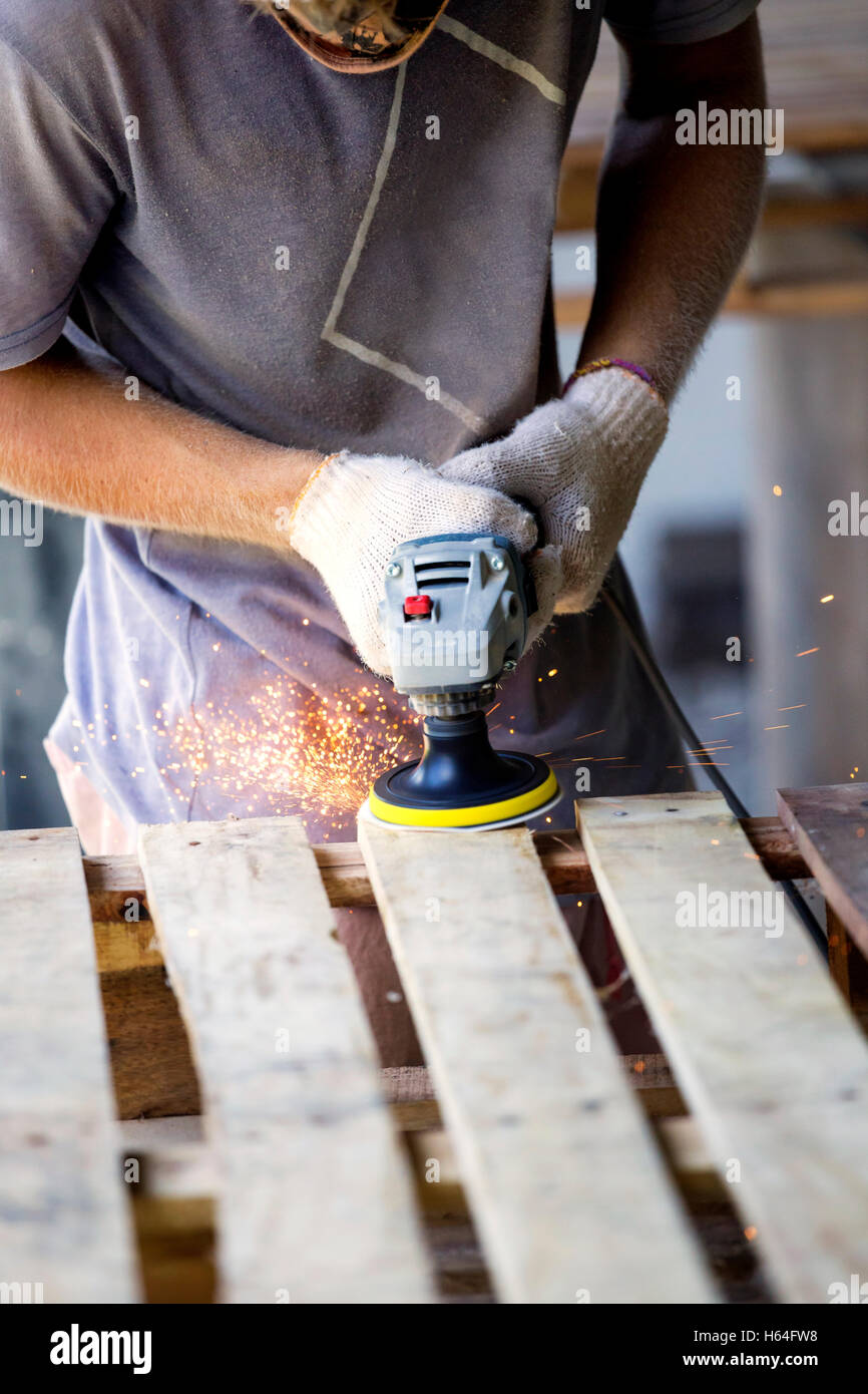 Man sanding wood with a random orbital sander Stock Photo Alamy