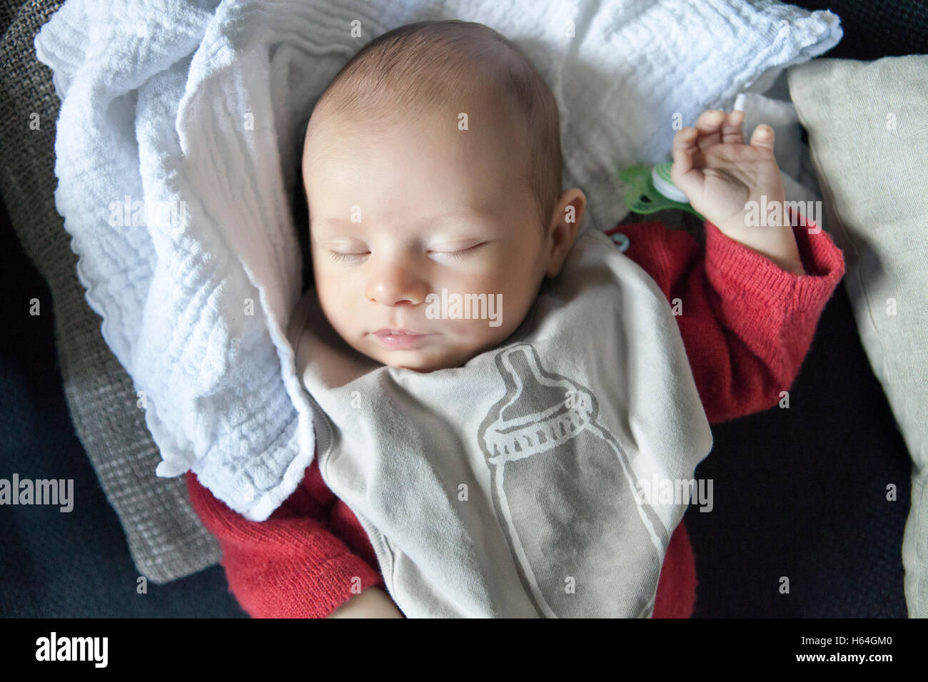 Baby sleeping after being fed Stock Photo Alamy
