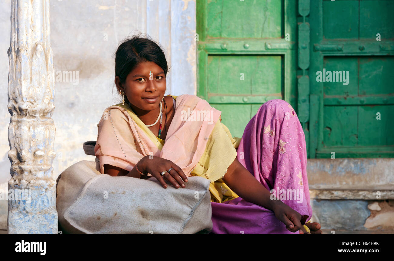 PUSHKAR, INDIA - NOVEMBER 21: Young smiling indian woman on the street in Pushkar Stock Photo