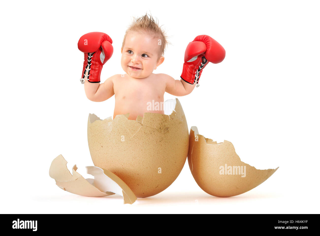 Beautiful baby boy with boxing gloves breaking the egg Stock Photo - Alamy