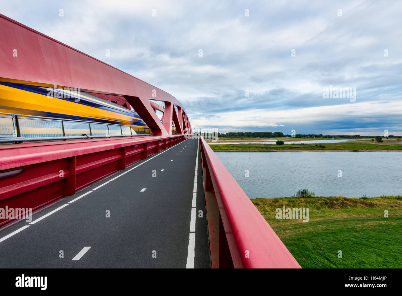 Dutch Train Crossing The IJssel River Stock Photo