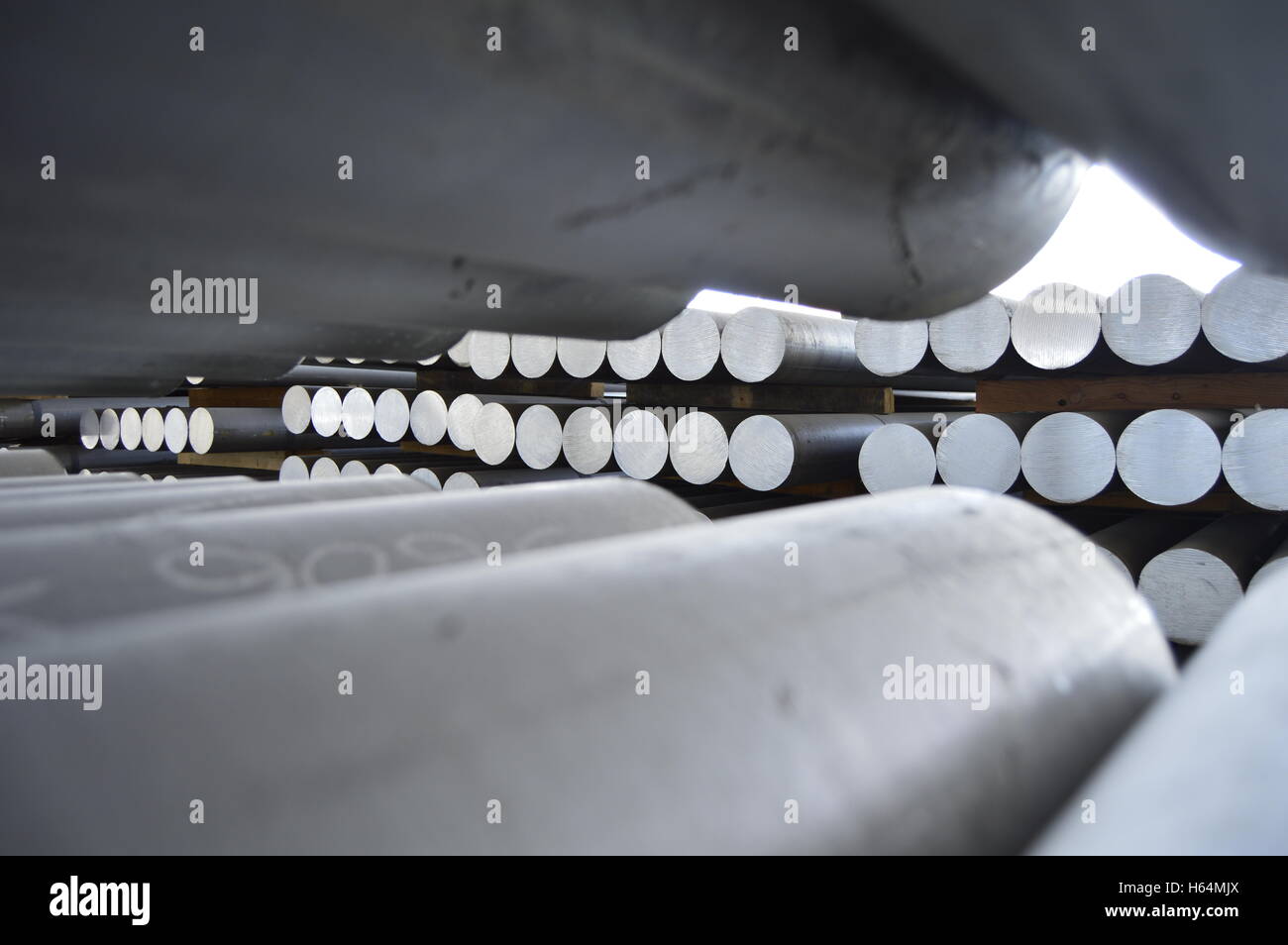 primary aluminum metal cylinder employed in the extrusion process. Stock Photo